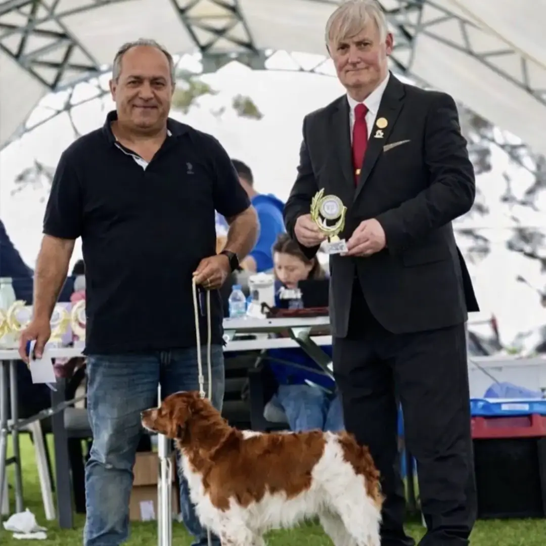 Trophy presentation with a judge at a dog show in Cyprus