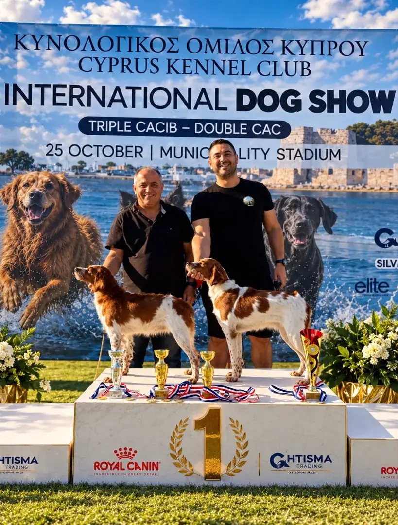 Andreas Demetriou and his team with two Brittany Spaniels and their trophies at the International Dog Show in Kiti, October 2026